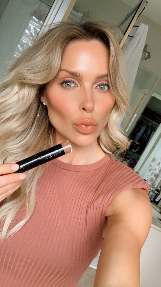 Katie Lynn BEAUTY Go Bare Lipgloss, held by model